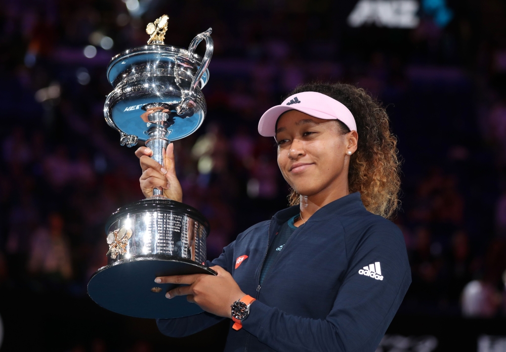 Japan's Naomi Osaka poses with the trophy after winning her match against Czech Republic's Petra Kvitova. REUTERS/Lucy Nicholson