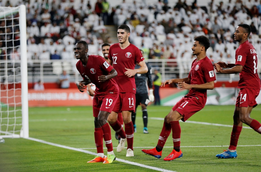 Qatar's Almoez Ali celebrates scoring their second goal with team mates REUTERS/Thaier Al-Sudani
