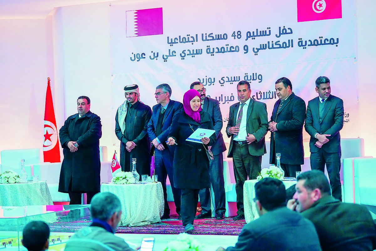 The representatives of Qatar Charity with local authorities at a ceremony held in Tunisia to distribute housing units.