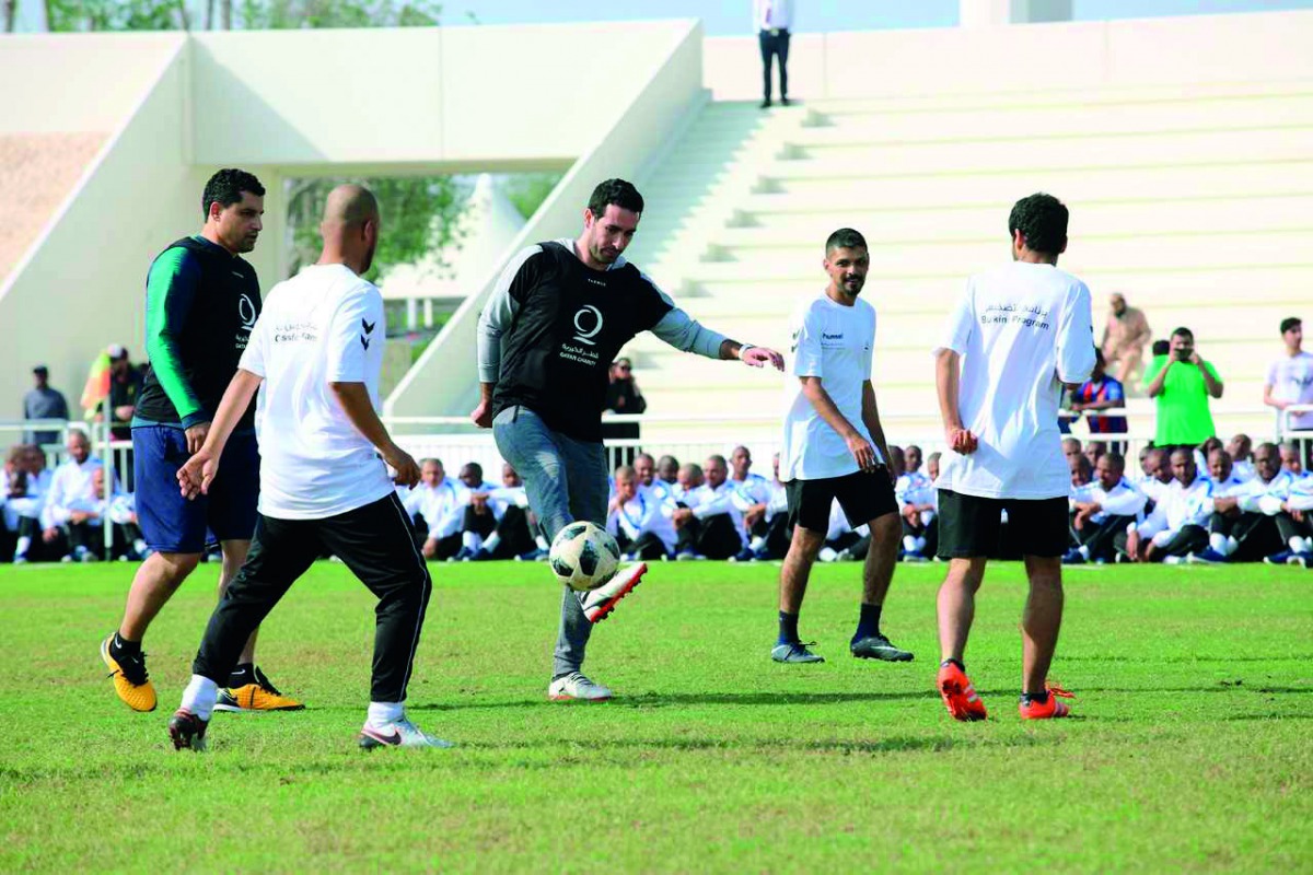 Qatar Charity officials participating in National Sport Day activities. 