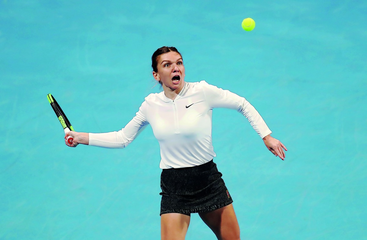 Romanian top seed Simona Halep in action against Ukraine’s Lesia Tsurenko during her round of 16 match  of the Qatar Total Open at the Khalifa International Tennis and Squash Complex in Doha, yesterday.