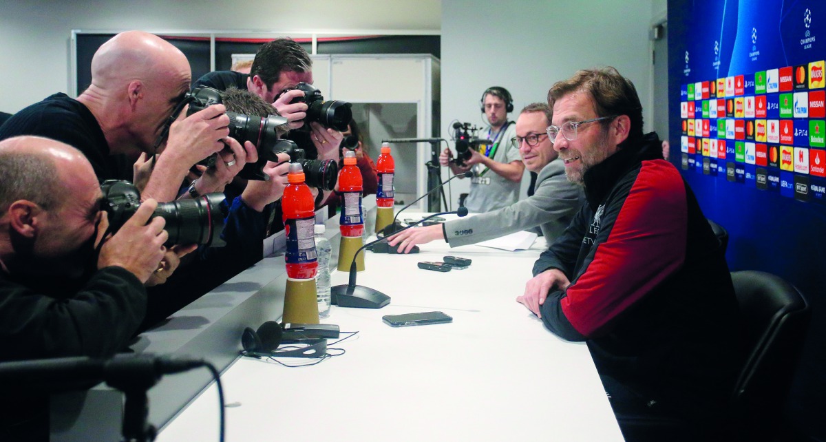 Liverpool's German manager Jurgen Klopp (R) attends a press conference on the eve of their Champions League round of 16, first leg football match against Bayern Munich at Anfield stadium in Liverpool, north west England on February 18, 2019. AFP / Lindsey