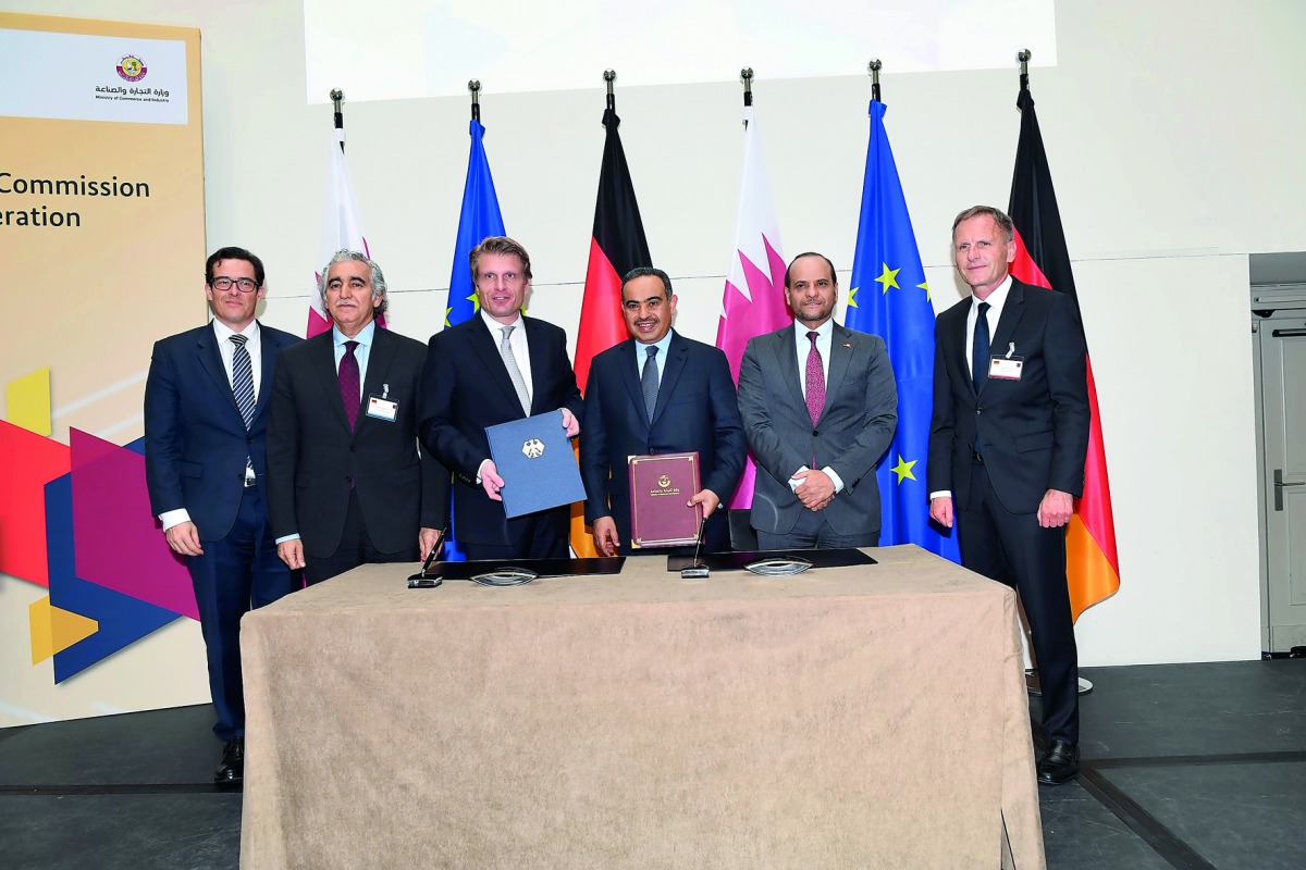 above: H E Ali bin Ahmed Al Kuwari, Minister of Commerce and Industry; Thomas Bareiß, Germany’s Parliamentary State Secretary at the Federal Ministry for Economic Affairs and Energy; and other officials pose for a picture. 
