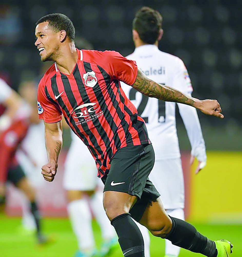 Al Rayyan’s Venezuelan striker Gelmin Rivas celebrates after scoring a goal against Iran’s Saipa during the AFC Champions League play-off match at the Jassim Bin Hamad Stadium in Doha,  yesterday.   