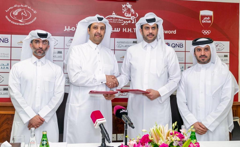 Qatar Equestrian Federation (QEF) President Hamad bin Abdulrahman Al Attiyah shaking hands with Salem Al Nuaimi, Acting General Manager at QNB’s Group Communications, in Doha after signing a sponsorship agreement yesterday. Bader Al Darwish, Secretary Gen