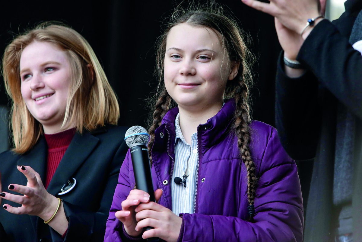 16 year-old Swedish climate activist Greta Thunberg and Belgian students gather to call for urgent measures to combat climate change during a demonstration in Brussels, Belgium, 21 February 2019. AFP / Aris Oikonomou
