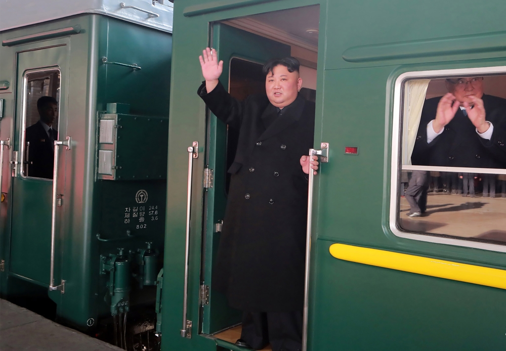 This picture taken on February 23, 2019, and released from North Korea's official Korean Central News Agency on February 24 shows Kim Jong Un (C) departing Pyongyang Station for the second North Korea-US summit meeting in Hanoi AFP /KCNA via KNS