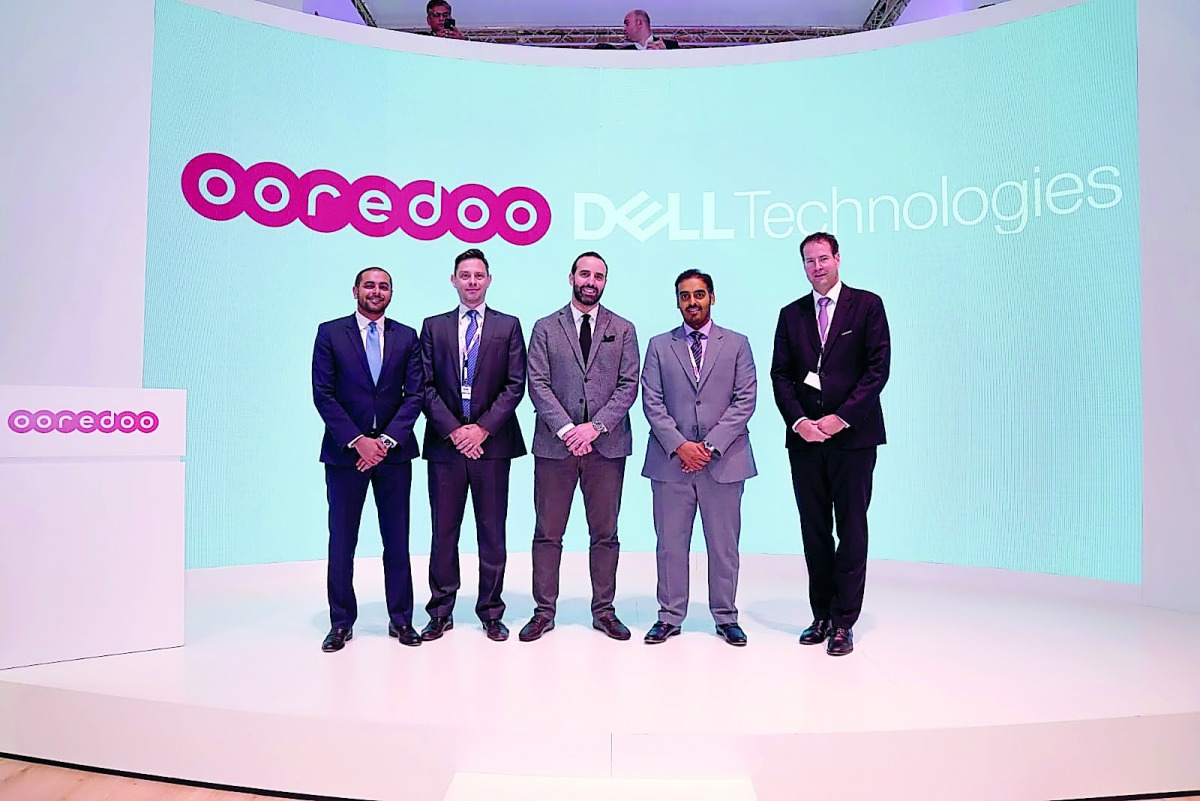 Sheikh Nasser bin Hamad bin Nasser Al Thani, Chief Business Officer, Ooredoo Qatar, and Ghassan Kosta, Country Manager - Qatar - Dell EMC, pose for a group photo with other officials.