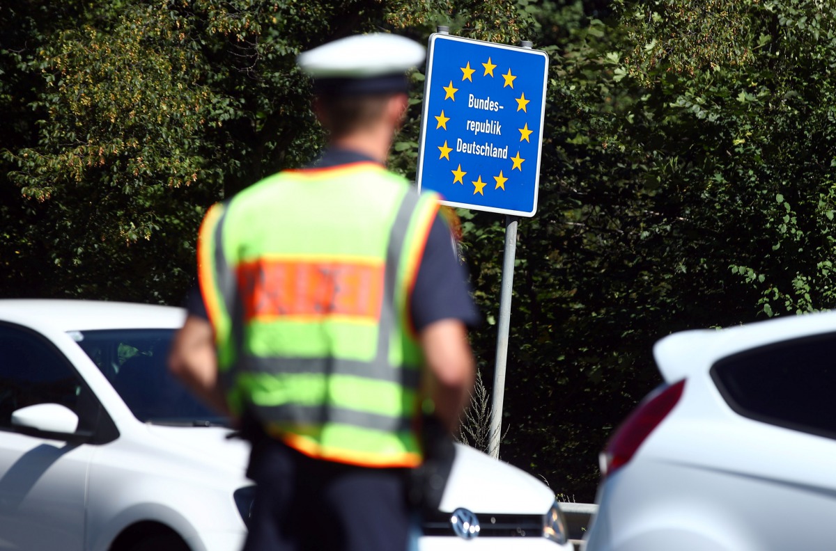 Bavarian Police Officers control cars at a checkpoint on the motorway between the Austrian and German border in Freilassing, Germany, August 27, 2018. Reuters/Michael Dalder