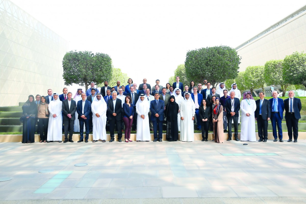 Total Research Center – Qatar (TRC-Q) officials pose for a photo during the event.