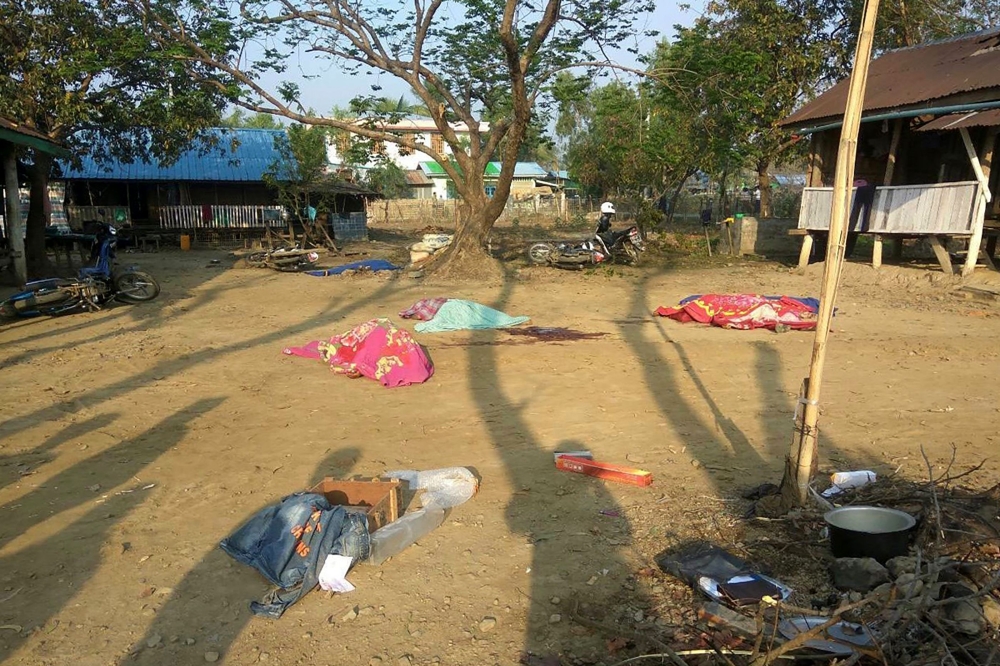 Bodies of policemen, killed in a militant attack, are covered at the Yoetayoke police station, near Sittwe in Rakhine State on March 10, 2019. AFP / STR
