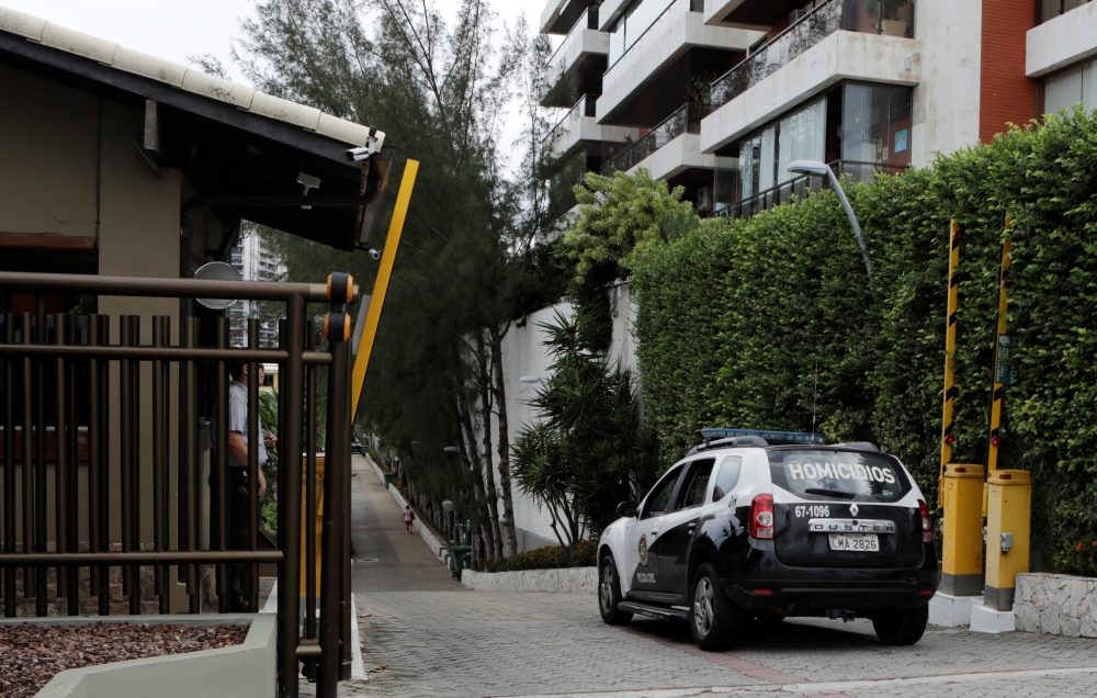 A police car arrives at a condominium where a suspect in the murder of activist and councilwoman Marielle Franco was arrested, the same condominium where Brazil's President Jair Bolsonaro has a residence, in Barra da Tijuca neighborhood, Rio de Janeiro, B