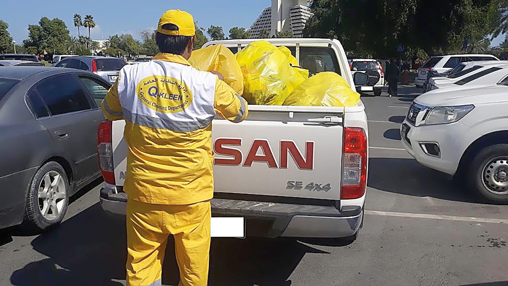An employee clearing the garbage.