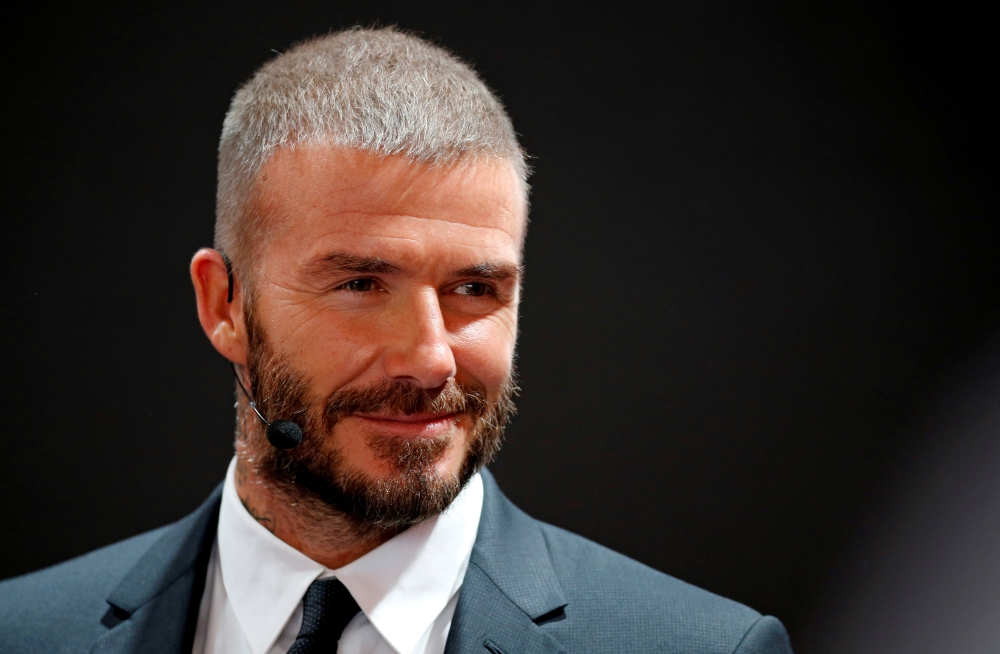 Former football player David Beckham visits the VinFast stand during the first press day of the Paris auto show, in Paris, France, October 2, 2018. Reuters/Regis Duvignau