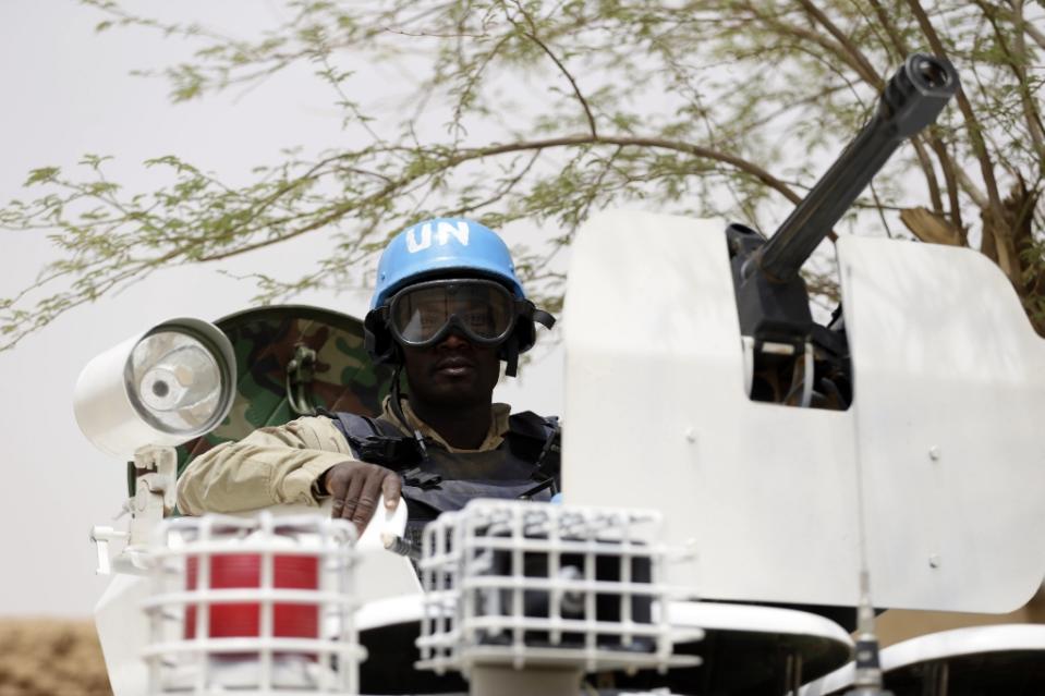 FILE PHOTO: United Nations UN soldiers patrol in the northern Malian city of Kidal on July 27, 2013. AFP/Kenzo Tribouillard