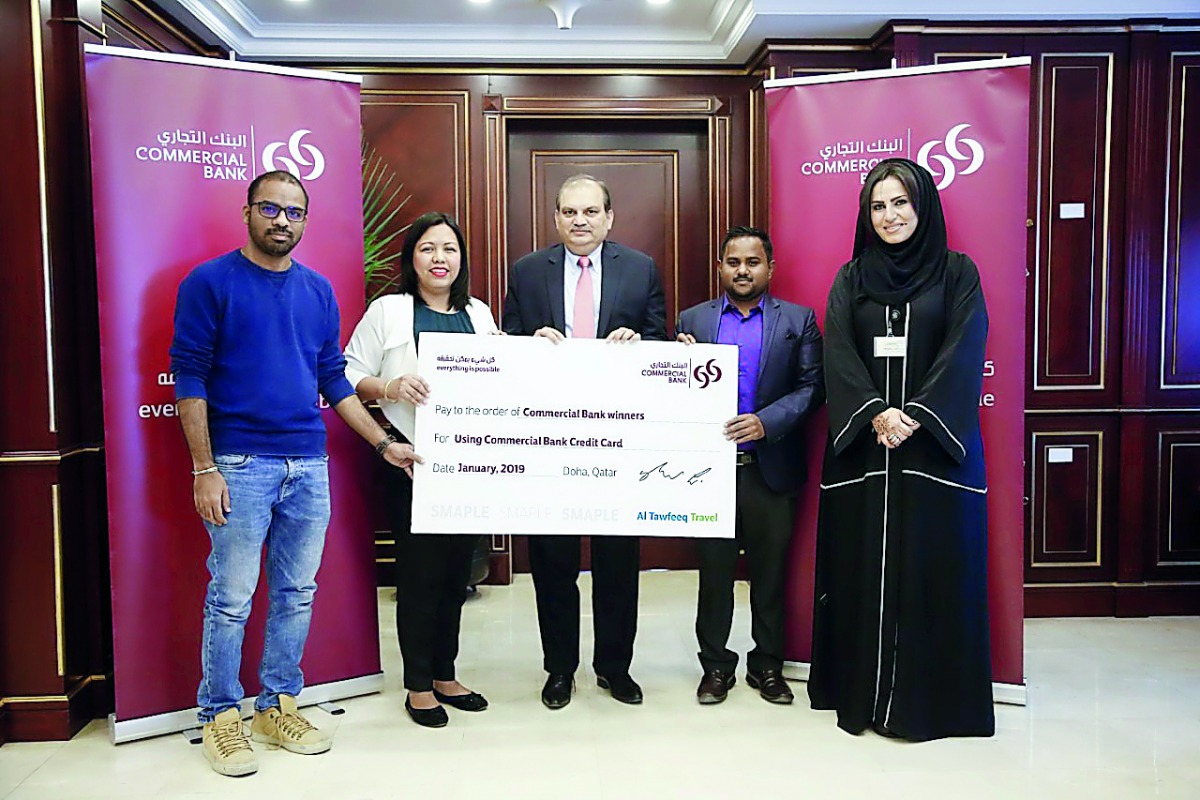 The winners with the Commercial Bank officials.