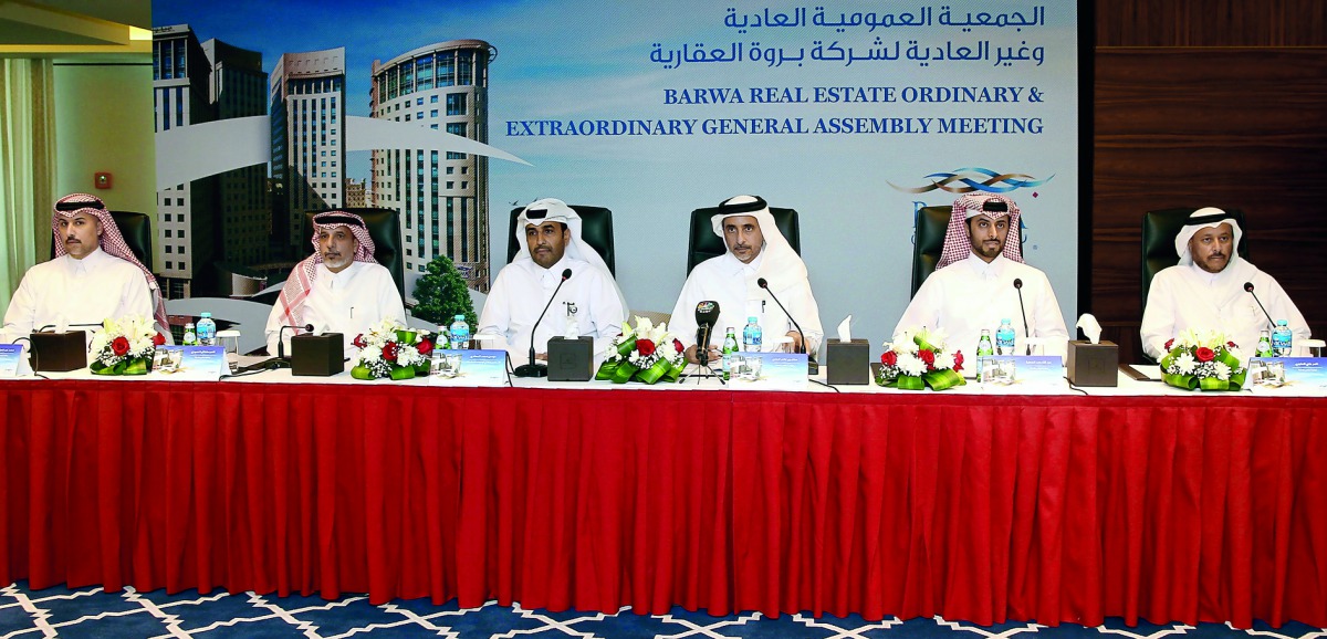 H E Salah bin Ghanim Al Ali (second right), Chairman of the Board of Barwa Real Estate Company; Issa Mohammed Al Mohannadi (second left), Vice-Chairman and Managing Director; and other Board Members, at the Company’s Annual General Meeting held yesterday 