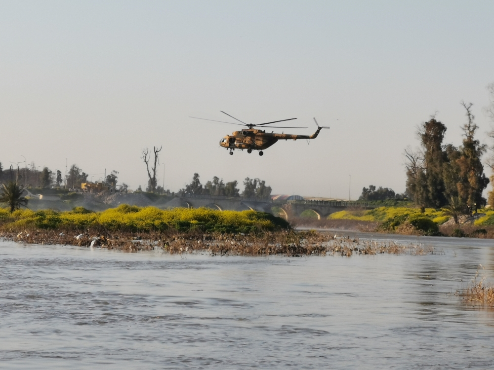 An Iraqi rescue helicopter searches for survivors at the site where an overloaded ferry sank in the Tigris river near Mosul in Iraq, March, 21,2019. Reuters/Stringer 