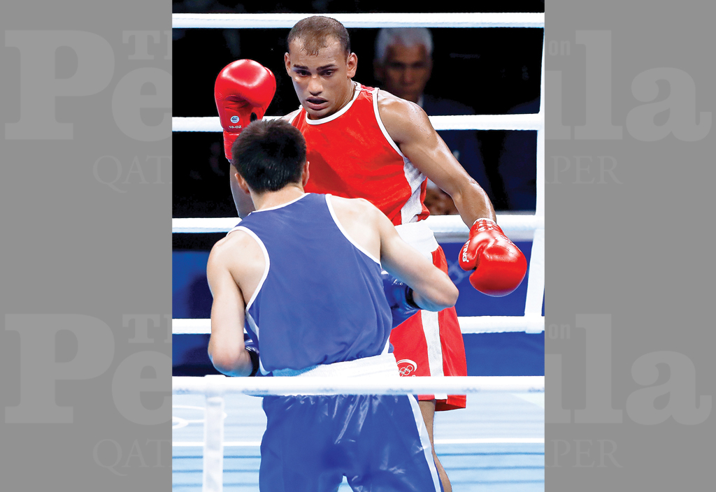 Qatar’s Thulasi Tharumalingam (top) in action in this file photo.