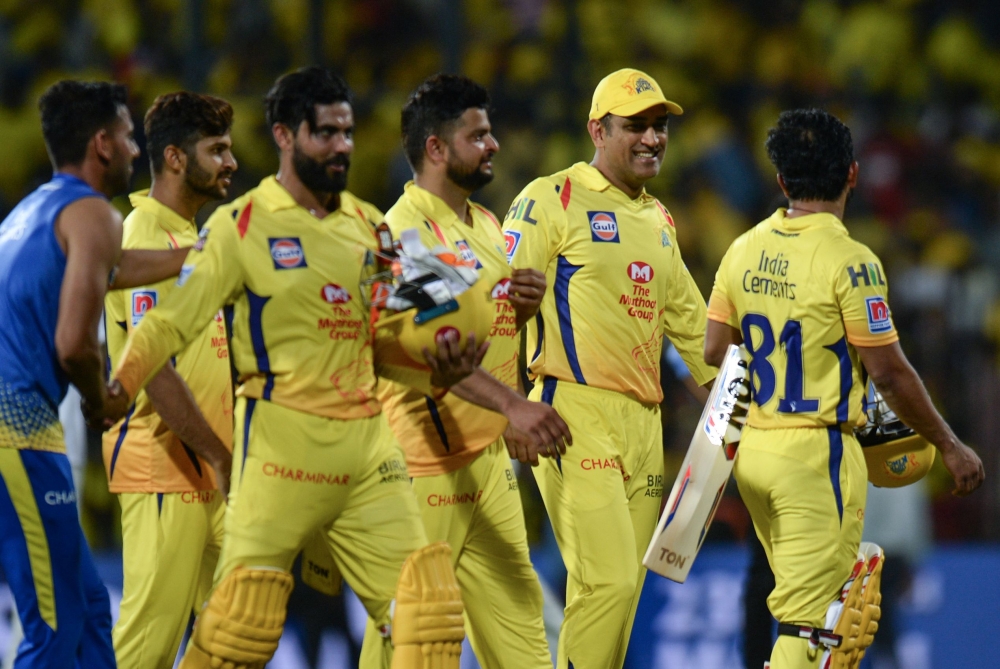 Chennai Super Kings Cricket captain Mahendra Singh Dhoni (2nd R) gestures along with his team after winning the Indian Premier League (IPL) Twenty20 cricket match between Chennai Super Kings and Royal Challengers Bangalore at the M. A. Chidhambaram Stadiu
