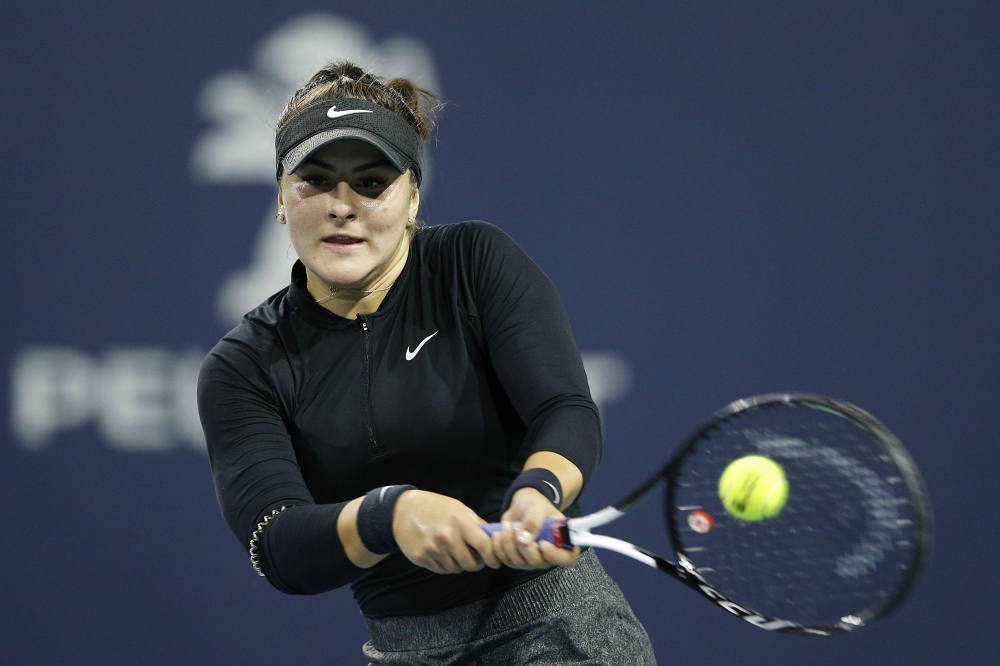 Bianca Andreescu of Canada returns a shot to Angelique Kerber of Germany during Day 6 of the Miami Open Presented by Itau at Hard Rock Stadium on March 23, 2019 in Miami Gardens, Florida. Michael Reaves/AFP
