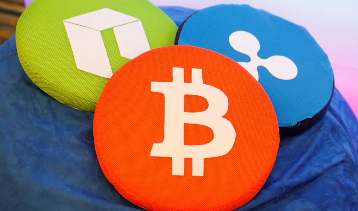 The Bitcoin logo is seen on a pillow on display at the Consensus 2018 blockchain technology conference in New York City, May 16, 2018. Reuters/Mike Segar