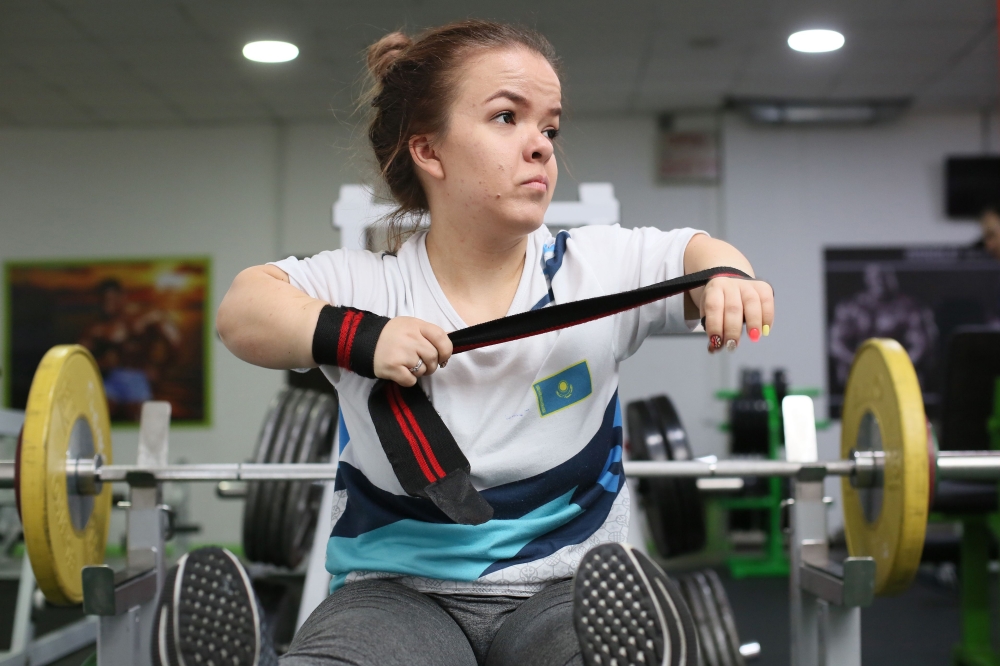 Kazakh Paralympic weightlifter Alina Solodukhina, 25, trains at a gym in Almaty on March 20, 2019. AFP/Ruslan Pryanikov 

