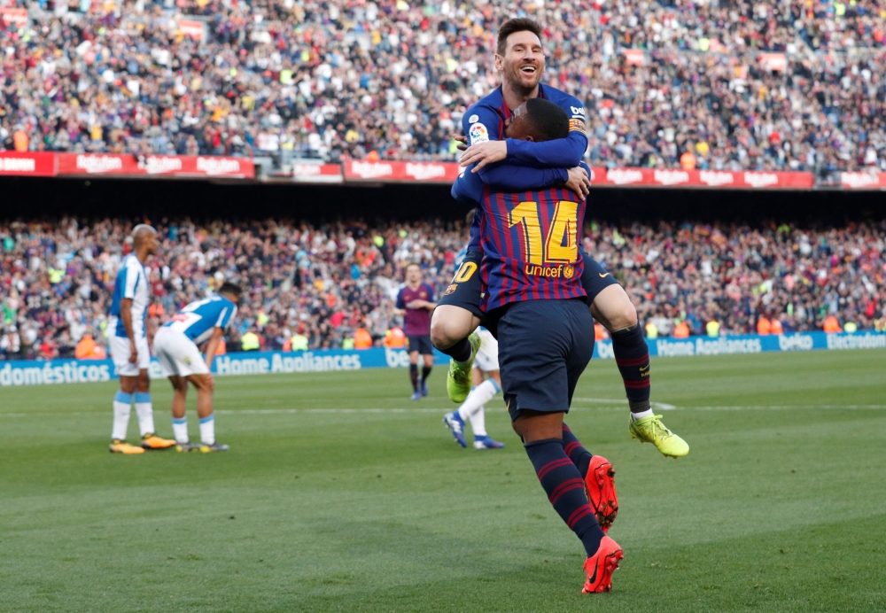 Barcelona's Lionel Messi celebrates scoring their second goal with Malcom REUTERS/Albert Gea