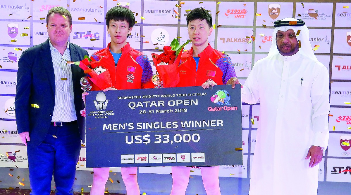 ITTF World Tour Platinum Qatar Open champion Ma Long (third left) and runner-up Lin Gaoyuan pose for a photograph with Khaleel Al Mohannadi (right), President of Qatar and Arab table tennis associations and International Table Tennis Federation CEO Steve 
