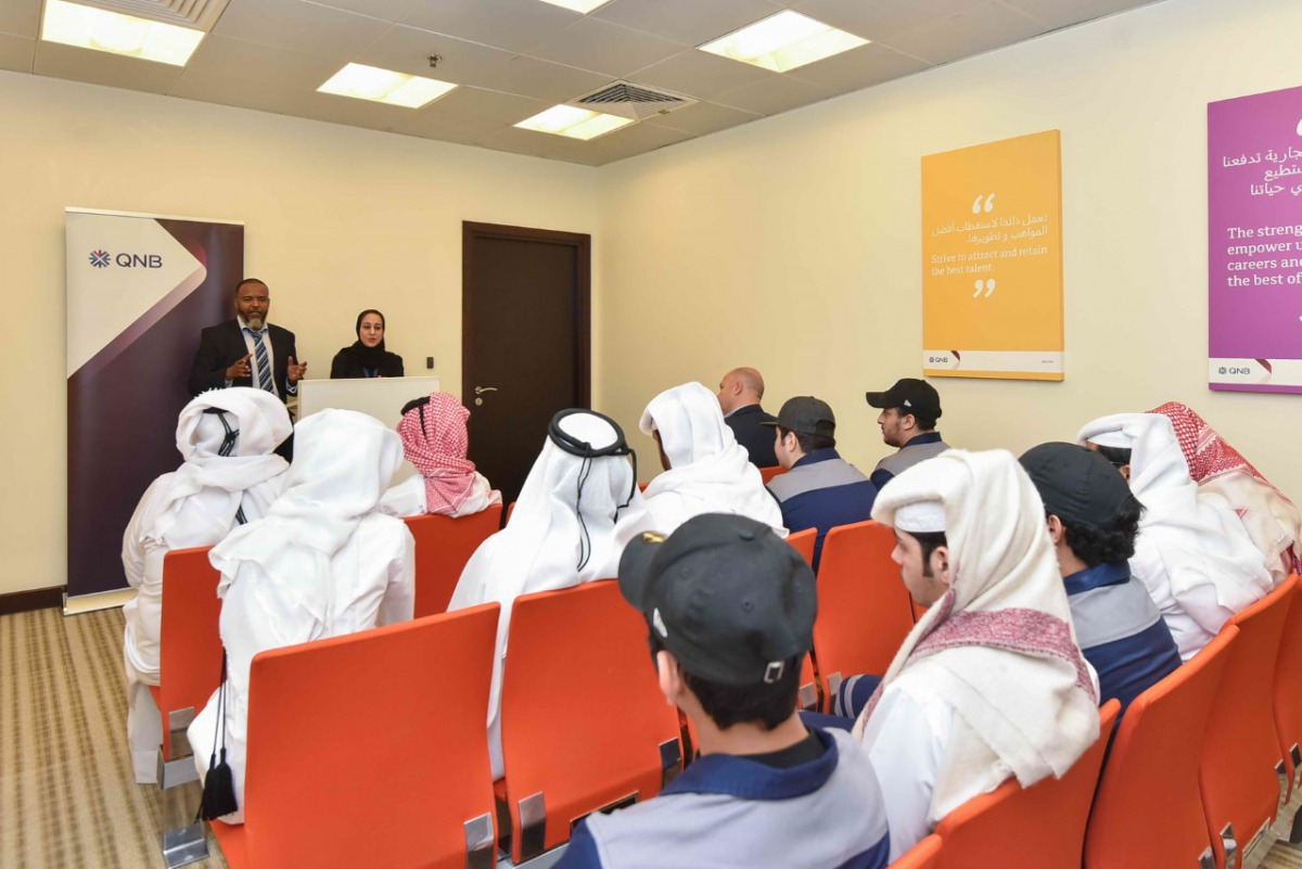 QNB officials briefing the visiting students on functions of the bank’s IT division.