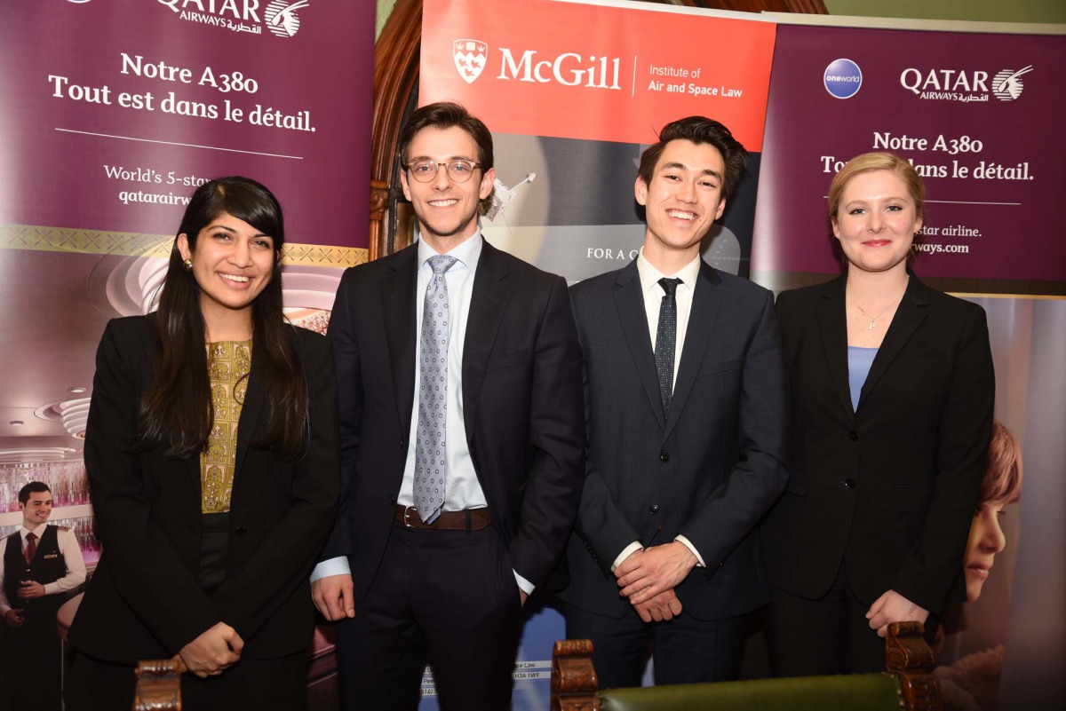 Participants pose during the inaugural Qatar Airways/McGill conference in Montreal, Canada on 