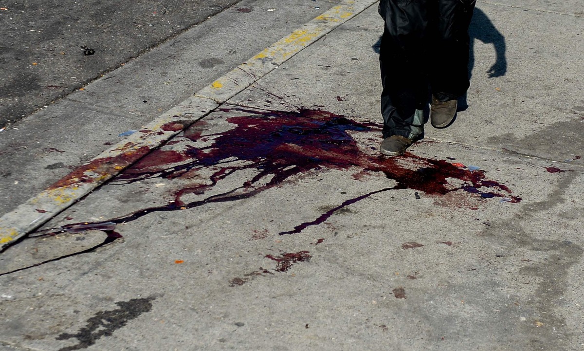 A man passes over a bloodstain in this AFP file photo in a different context. Image used for representation  