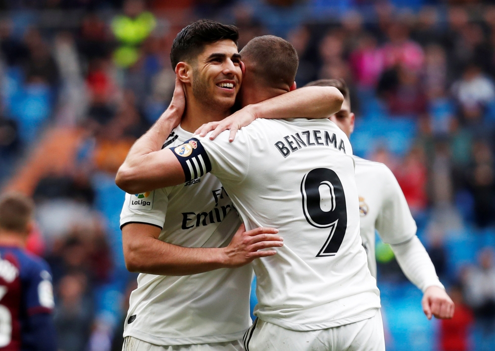 Real Madrid's Karim Benzema and Marco Asensio celebrate scoring their second goal REUTERS/Javier Barbancho