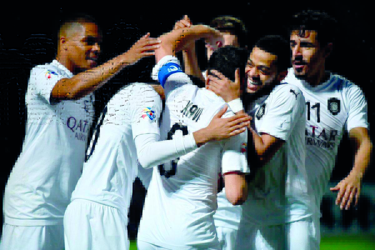 Al Sadd’s Spanish midfielder Xavi Hernandez (centre) is congratulated by team-mates after he scored the second goal against Uzbekistan’s Pakhtakor during their AFC Champions League (ACL) Group D match yesterday.
