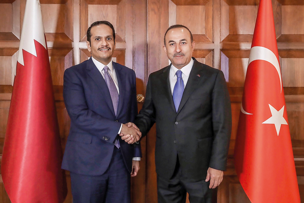 Deputy Prime Minister and Minister of Foreign Affairs H E Sheikh Mohamed bin Abdulrahman Al Thani with Turkish Foreign Minister Mevlut Cavusoglu, in Ankara yesterday.