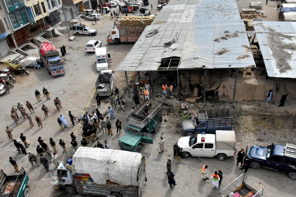 Rescue workers and army soldiers gather at the site of a blast at a vegetable market in Quetta, Pakistan April 12, 2019. REUTERS/Naseer Ahmed
