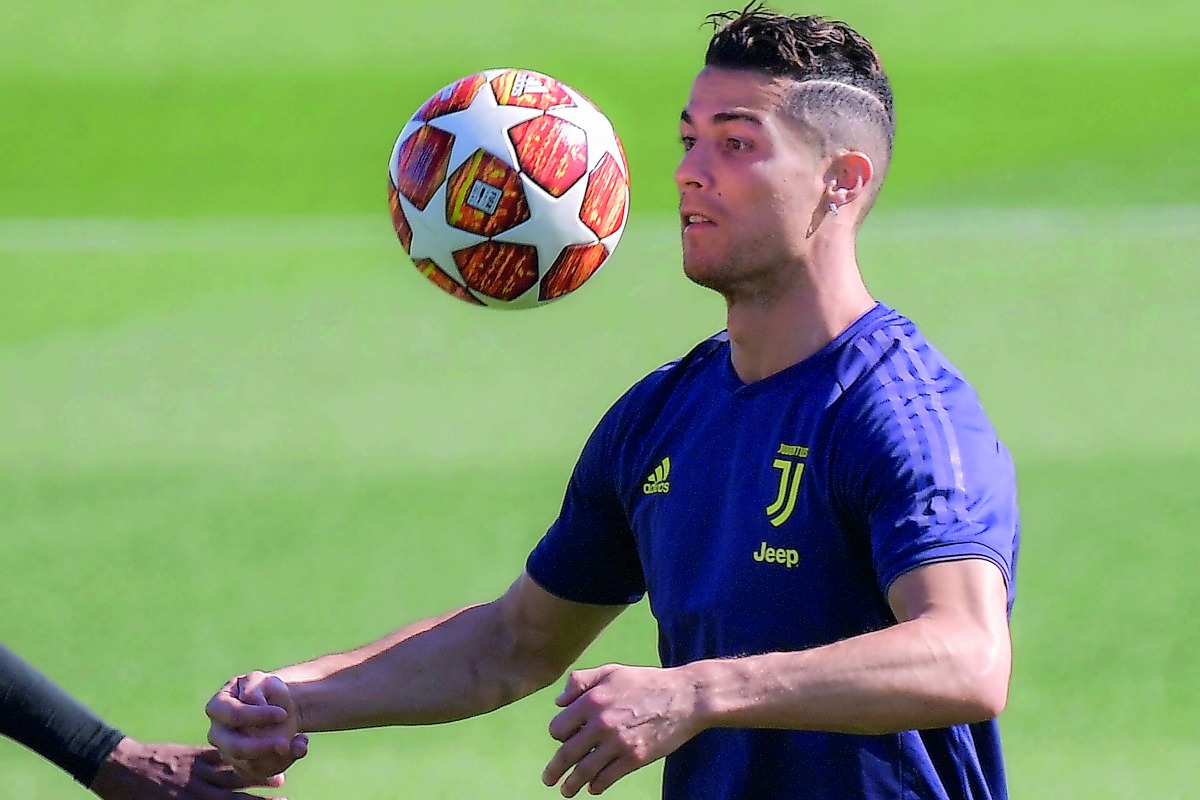 Juventus' Portuguese forward Cristiano Ronaldo juggles with a ball during a training session on April 15, 2019 at the Continassa training center in Torino, on the eve of the UEFA Champions League quarter-final second leg football match Juventus vs Ajax Am