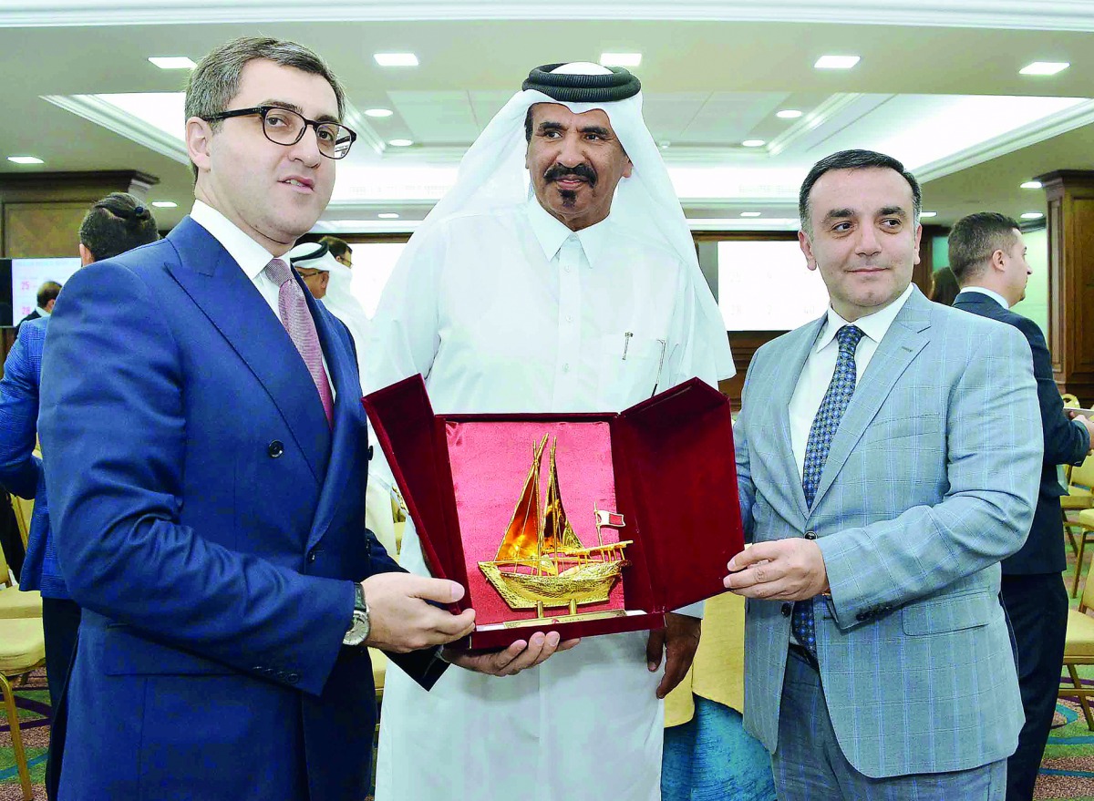 Qatar Chamber’s First Vice-Chairman Mohamed bin Ahmed Towar Al Kuwari (centre) honouring the head of the Azeri delegation, Yusif Abdullayev Ikram Oglu (left), and Ambassador of Azerbaijan to Qatar, Rashad Ismayilov with a memento, at QC headquarters, yest