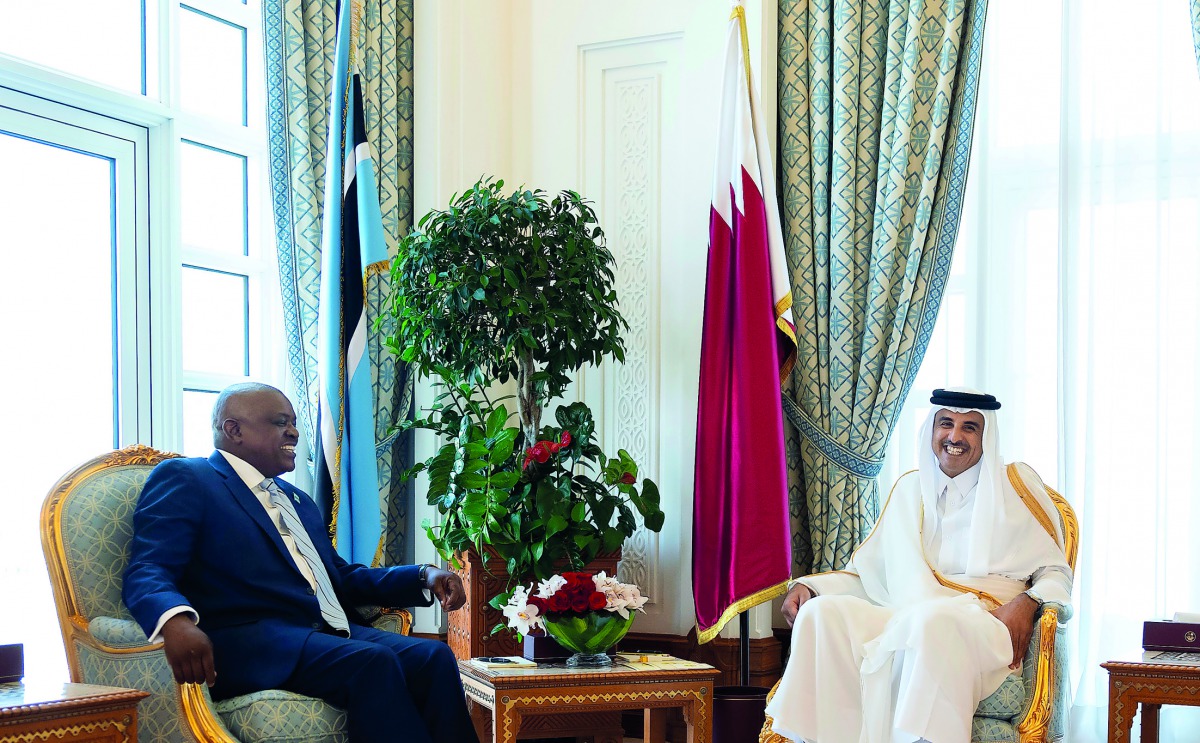 Amir H H Sheikh Tamim bin Hamad Al Thani with the President of the Republic of Botswana, Dr. Mokgweetsi Masisi, at the Amiri Diwan, yesterday. ?P2