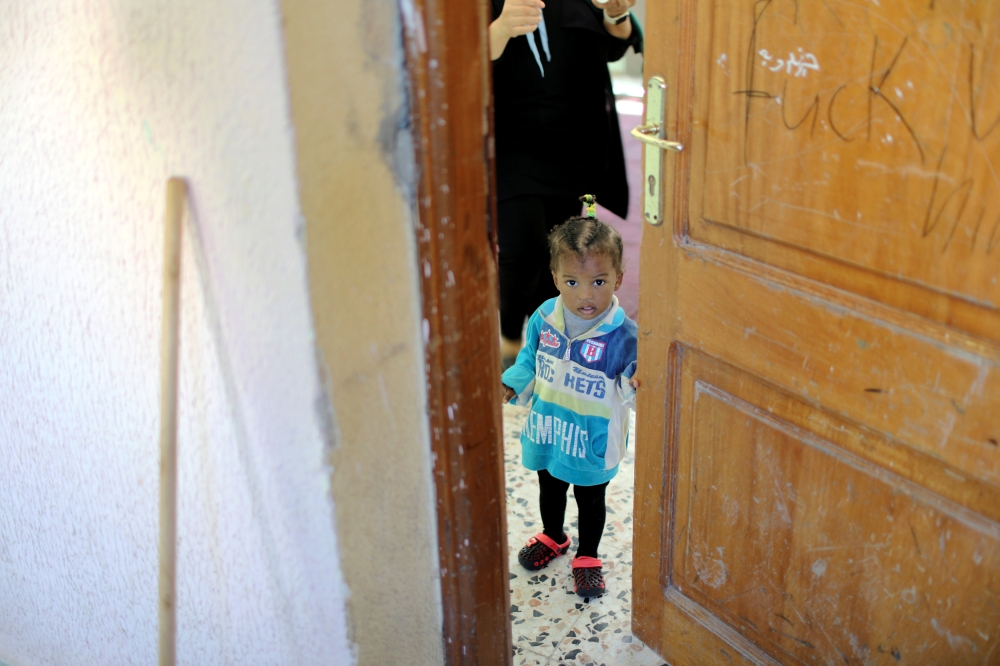 FILE PHOTO: A Libyan displaced child, who fled her house because of the fighting between the Eastern forces commanded by Khalifa Haftar and the internationally recognised government, is seen at Bader School, which is used as a shelter, in Tripoli, Libya A