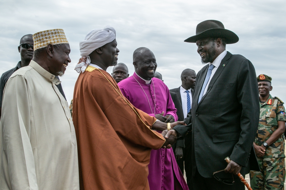 South Sudan‘s President Salva Kiir (R) is greeted by religious leaders on his arrival from Rome, at Juba International Airport in Juba, South Sudan on April 13, 2019. AFP / Akuot Chol
 