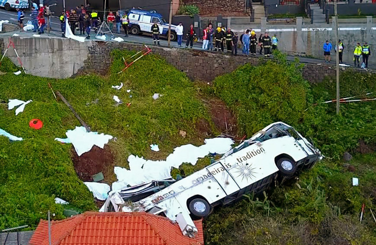 A video grab obtained from drone footage shows the wreckage of a tourist bus that crashed on April 17, 2019 in Canico, on the Portuguese island of Madeira. AFP 