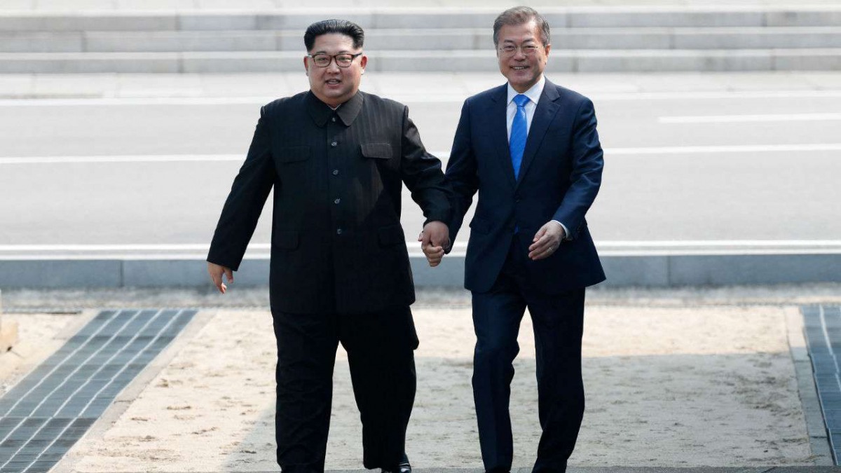 File photo of North Korea's Kim Jong-un, South Korea's Moon Jae-in plant tree for peace at border , Reuters