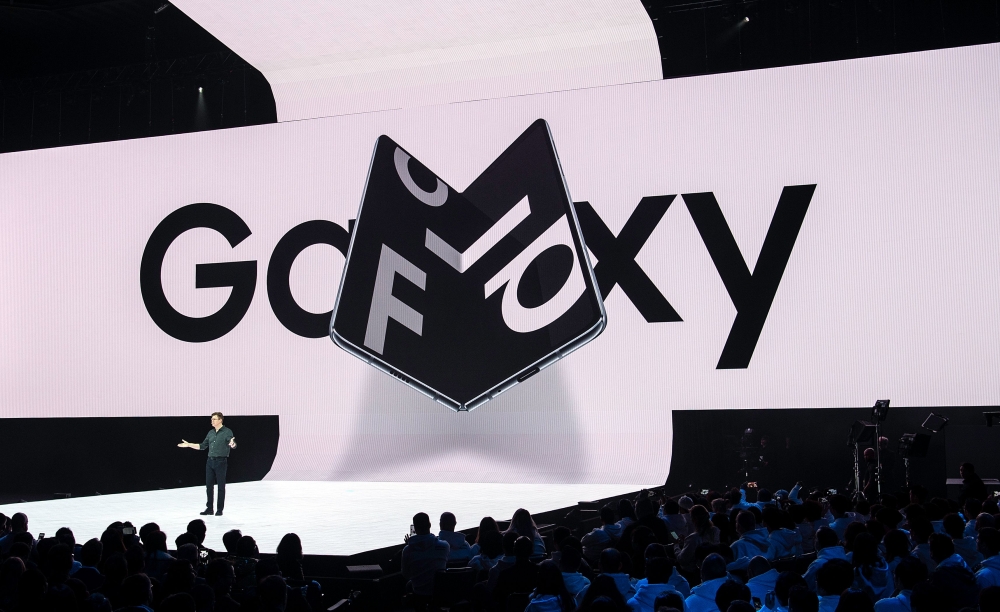 Samsung senior VP of product marketing Justin Denison speaks on stage about the new foldable phone during the Samsung Unpacked product launch event in San Francisco, on February 20, 2019. AFP / Josh Edelson
 