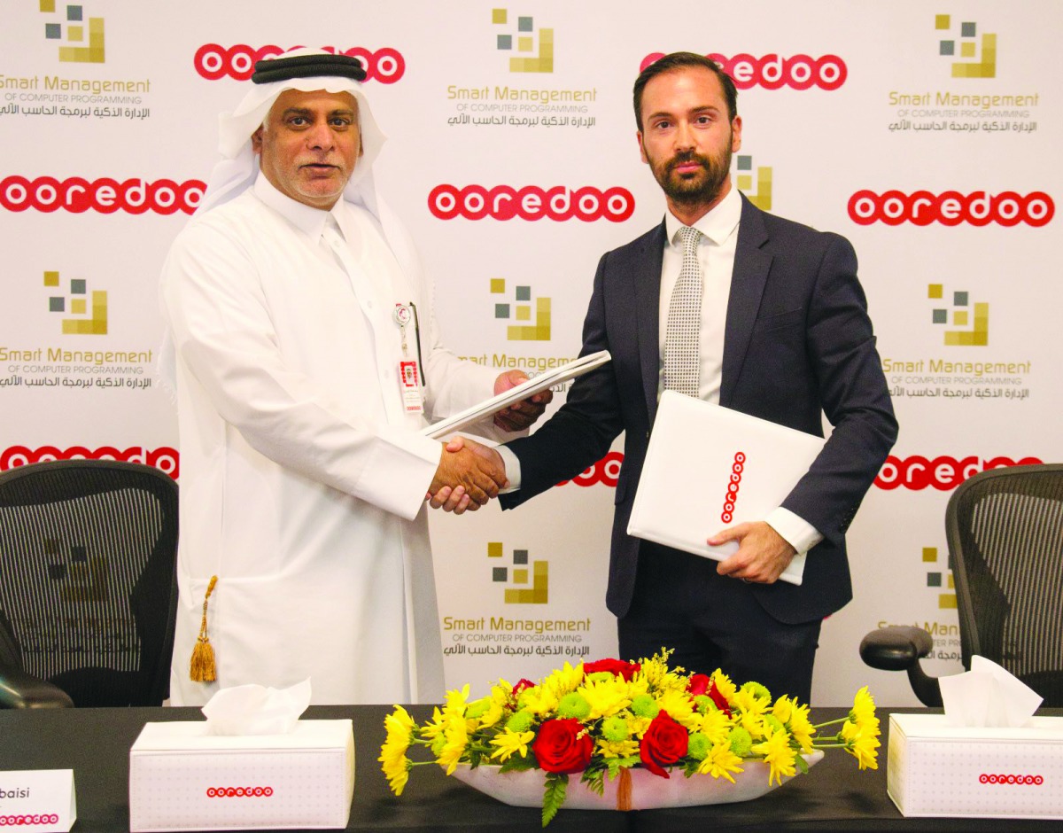 Yousuf Abdulla Al Kubaisi, Ooredoo Qatar COO, and Andrew Doxsey, GM, Smart Management IT Solutions.