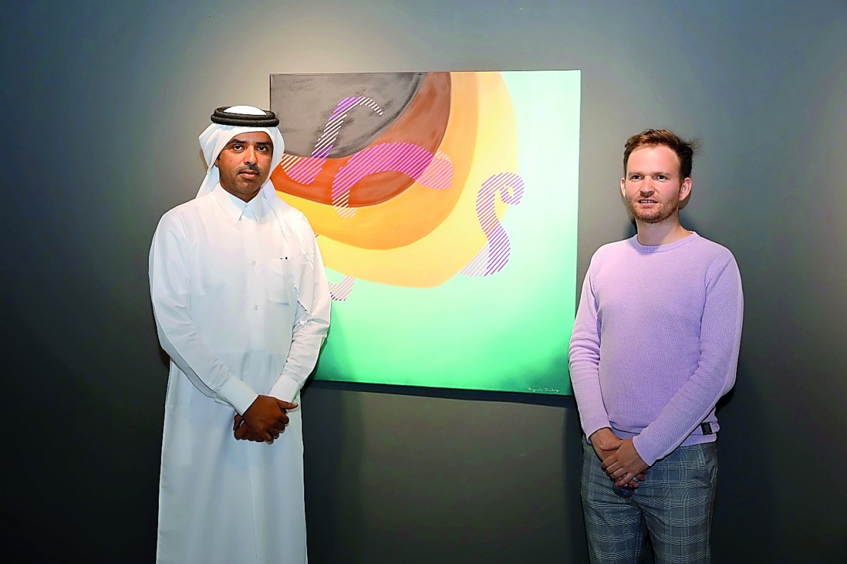 Serbian graffiti artist, Dimitrije Bugarski (right), with Saif Al Dosari, Human Resources Director at Katara, at the opening of his solo exhibition “Lined Up” at Katara Building 22.