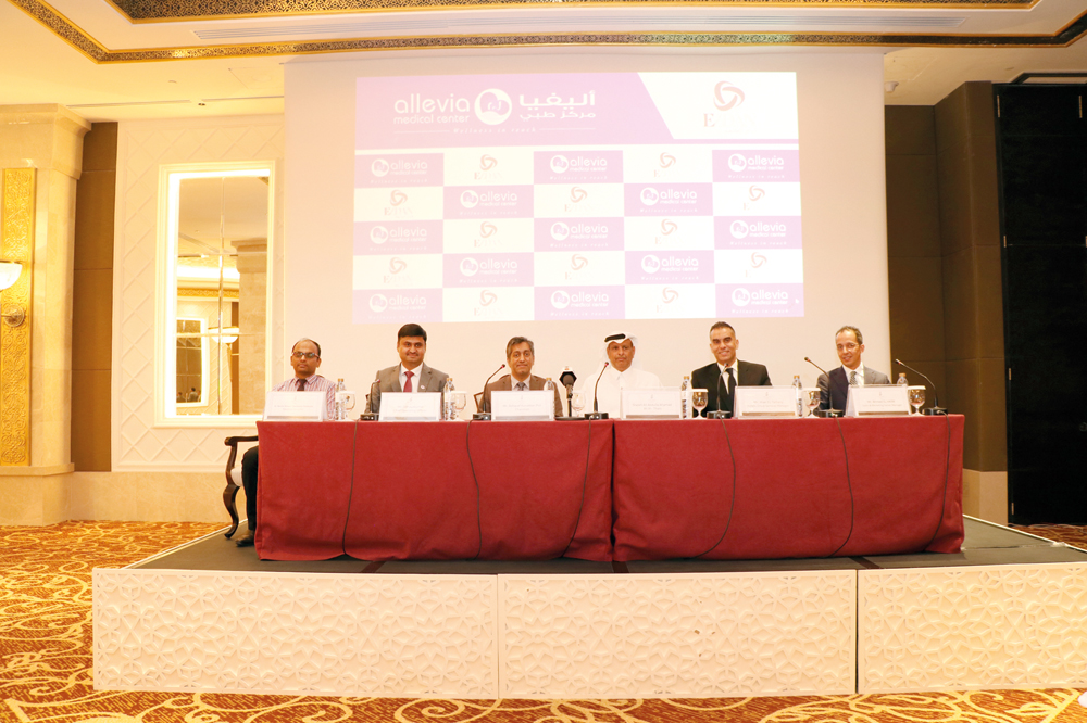 Allevia Medical Center officials — Sheikh Ali Abdulla Ahamad Ali Al Thani, President; Asharaf KP, Founder; Udhya Kumar, Chief Operating Officer; and Dr Noufal Rizwan Tharagnar Abubacker, Medical Director; along with the officials of Ezdan Holding — Wael E