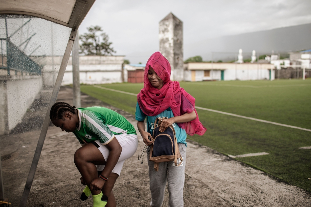 Football Club Mamans (F.C. Mamans) Nadjima Bacar (R) and Hairiat Abdourahmane (L) , Captain of the Comoros Women Football National team get ready for a training session in Moroni, Comoros on March 23, 2019. AFP / Gianluigi Guercia 