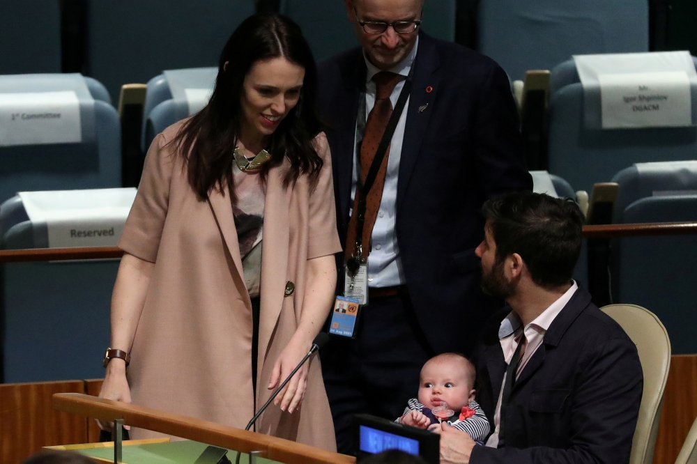 File photo of New Zealand Prime Minister Jacinda Ardern walks back to her baby Neve and partner Clarke Gayford, after speaking at the Nelson Mandela Peace Summit during the 73rd United Nations General Assembly in New York City, New York, U.S., September 2