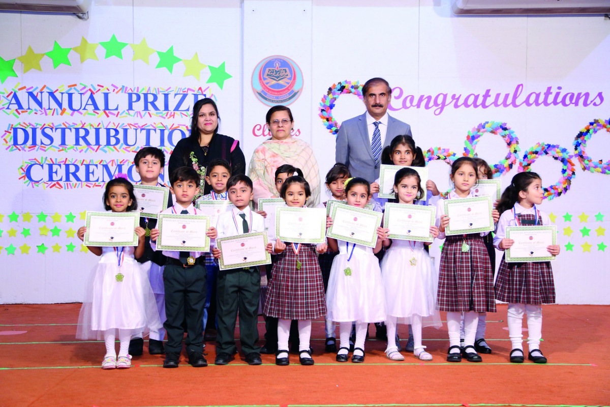 Syed Ahsan Raza Shah, Ambassador of Pakistan, with the award winning students of KG and the Principal and Vice-Principal of PISQ. 